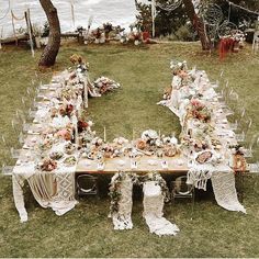 a long table is set up in the grass