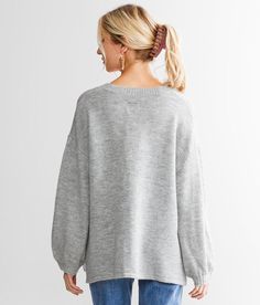 Billabong Sol Chasing Henley Sweater - Grey Small, Women's Athleticgrey Oversized quarter button sweater Bust measures 46 on size small Body length 24 on size small. Layering piece(s) and/or accessories sold separately.. 68% Acrylic 17% Nylon 12% Polyester 3% Elastane. Machine wash cold gentle cycle. Do not bleach. Tumble dry low. Cool iron if needed. Do not dry clean.. Measurements: Bust -Fullest part of bust with arms at sides. Waist -Circumference of natural waist: above belly button below ri Casual Balloon Sleeve Sweater For Fall, Balloon Sleeve Sweater For Fall Loungewear, Casual Knit Sweater With Balloon Sleeves, Casual Balloon Sleeve Sweater For Loungewear, Oversized Balloon Sleeve Sweater For Fall, Casual Balloon Sleeve Tops, Casual Soft Knit Sweater With Balloon Sleeves, Casual Balloon Sleeve Loungewear Sweater, Fall Balloon Sleeve Sweatshirt