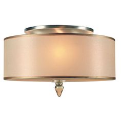 a light fixture with a beige shade on it