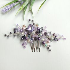 I am happy to welcome you in my store.  Every bride dreams of looking special and gorgeous on her wedding day. My jewellery and accessories will help you in it This bridal hair piece is made of: -crystal beads  -crystal rhinestones  -jewelry wire  -hair comb  On the picture of the product you see a purple wedding hair comb using :  purple crystal beads,purple pearl beads, purple and rainbow crystal rhinstones and high quality silver jewelry wire.  The length of the decoration on the photo is 5 inches Additional Information  -Product will be placed into a gift box -If you need a different color, you can choose it in the list -100% handmade If you need jewelry or accessories in the color of your wedding, please let me know about it. I will certainly make it the way you need it. Besides, I'd Festive Purple Wedding Jewelry, Purple Wedding Hair Accessories, Gold And Purple Hair Pieces, Purple Wedding Hair, Purple Amethyst Brooches For Wedding, Purple Flower-shaped Jewelry For Weddings, Bridal Hair Piece, Lavender Hair, Wedding Hair Comb