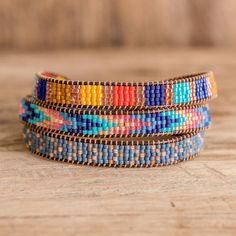 multicolored beaded bracelets stacked on top of each other