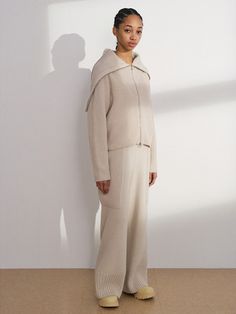 Editor's Notes Long sleeve knit cashmere and wool blend cardigan in ivory.- Loose fit- Rib knit spread collar, cuffs and hem- Two-way zipper closure at front- Silver-tone hardwareMeasurements(in.)XS / S / L- Total length: 20.47 in. / 21.26 in. / 22.83 in. - Chest: 19.69 in. / 20.47 in. / 22.05 in. - Sleeve length: 25.98 in. / 26.77 in. / 28.35 in. Model info: M - Height - 6' 07 Fitting Size: L / W - Height - 5' 81 Fitting Size: SComposition & Care- Cashmere 5% Wool 60% Ny Cream Long Sleeve Cashmere Sweater Coat, Cream Cashmere Sweater Coat With Long Sleeves, Neutral Long Sleeve Cashmere Outerwear, Cream Wool Outerwear With Ribbed Cuffs, Wool Outerwear With Ribbed Cuffs In Cream, Cream Wool Cardigan With Ribbed Cuffs, Neutral Cashmere Long Sleeve Outerwear, Beige Cardigan With Ribbed Collar For Work, Cream Polo Sweater For Fall Workwear