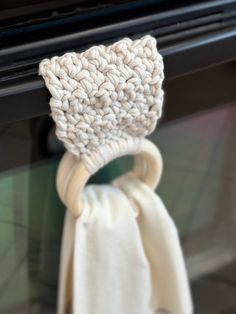 a close up of a knitted object near a stove