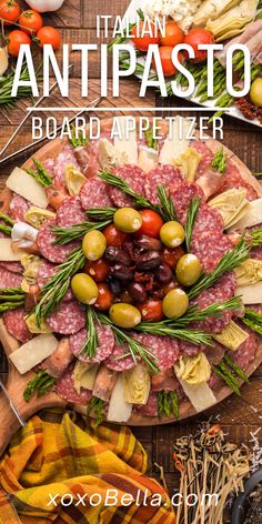 a platter filled with meats and olives on top of a wooden table