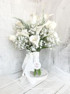 a bouquet of white flowers in a vase