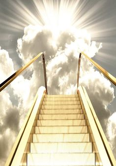 an escalator going up into the sky with clouds and sun shining down on it