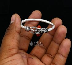 925 sterling silver handmade gorgeous customized design Shiva trident baby bangle bracelet, excellent personalized gifting kids jewellery from india. Metal-925 silver. Item type-Baby kada Weight-6.780 grams.(single) Size-4.0 cm or 1.5 " inner diameter) Width-2.5 mm. Quantity-1 piece Make excellent gifting for birthday , mother's day, wedding, anniversary, father's day, Christmas day, valentines day, White Spiritual Bangle Jewelry, Adjustable Silver Jewelry For Rituals, Traditional White Sterling Silver Bracelets, Symbolic Bracelet Jewelry For Puja, Adjustable Silver Jewelry For Puja, White Sterling Silver Jewelry For Festivals, White Ceremonial Bangle Jewelry, White Round Jewelry For Rituals, Ceremonial White Bracelet Jewelry