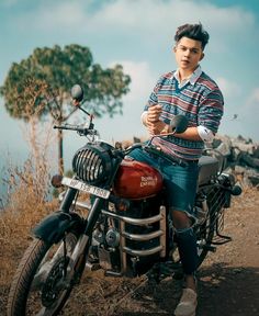 a man sitting on top of a motorcycle