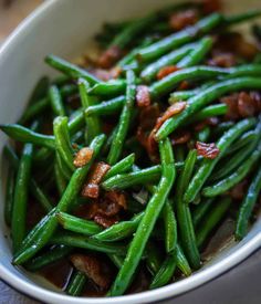 green beans with bacon in a white bowl