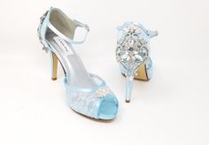 "Blue Lace Bridal Shoes with a sparkling crystals on the front and back of the shoes. Lace Wedding shoes available in over 100 additional colors, including white and ivory. We can also color match a sample you send us. These beautiful satin and lace wedding shoes are approximately 3 1/2 inches. They have a slight platform and an adjustable ankle strap for a secure fit. The listing picture shows the shoes in ivory. You can also pick from my color chart or send us a sample swatch to color match. * Bridal Shoes Lace, Lace Bridal Shoes, Lace Wedding Shoes, Blue Bridal Shoes, Custom Wedding Shoes, Ivory Bridal Shoes, How To Dye Shoes, Blue Wedding Shoes, Wedding Shoes Lace