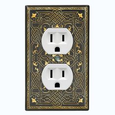 an electrical outlet with two white outlets and gold trimmings on the cover is shown