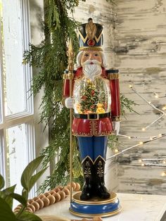 a christmas nutcracker is sitting on a table