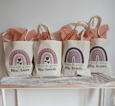 three bags with designs on them sitting on a table