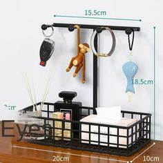 the shelf is holding various items and hanging from it's hooks, along with other accessories