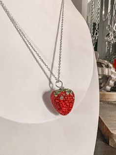 Strawberry rhinestone pendant necklace on dainty silver chain. The chain is adjustable fit. Silver Bling Crystal Necklaces As Gift, Sparkling Metal Rhinestone Necklace Gift, Metal Rhinestone Necklace Gift, Silver Sterling Silver Rhinestone Necklace For Gift, Gift Rhinestone Necklace With Adjustable Chain, Silver Rhinestone Round Pendant Necklace For Party, Silver Rhinestone Necklace For Gift, Silver Rhinestone Necklace With Round Pendant For Party, Gift Charm Necklaces With Rhinestones