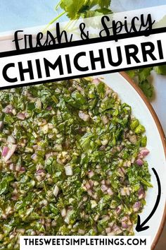 a white plate topped with chopped green vegetables next to cilantro and lime leaves