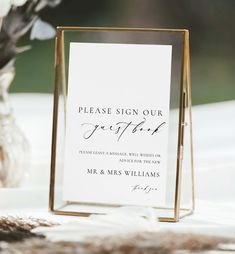 a sign that says please sign our guests for their wedding day and the date is written in cursive writing