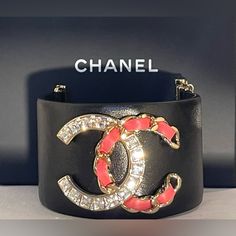 Stunning Chanel Bracelet With Rhinestone Cc Logo. 100% Authentic!!! Very Hard To Find!!! Chanel Is Currently Not Producing This Style Leather Bracelet. Bracelet Is In Very Good Condition. Don’t Miss Out In This Rare Piece!!! Length 6” (Leather Only)..6 1/2” Total. Basically Fits Wrist. 6” Or Smaller, 1 3/4” Wide. Comes With Original Box And Card. Please See All Photos....Talk About Making A Statement!!! Dimensions: Chanel Bracelet, Jewelry Chanel, Chanel Jewelry, Cc Logo, Logo Color, Womens Jewelry Bracelets, Talk About, Leather Bracelet, Original Box