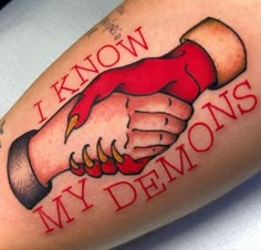 a close up of a person's arm with a tattoo on it that says i know my demons