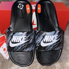 Men’s Size 6 (Women’s Size 7.5, But Also Fits An 8 Considering These Slides Don’t Come In Half Sizes). Brand New & Never Worn! Upper Contains Synthetic Leather. Black Nike Sneakers With Logo Print, Casual Sports Slides With Round Toe, Gray Slip-on Sports Slides, Casual Sports Slides Slip-on, Sporty Gray Slip-on Slides, Casual Round Toe Slides For Sports, Casual Slip-on Sports Slides, Black Sporty Flat Sneakers, Slip-resistant Low-top Slides For Sports