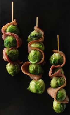 bacon wrapped brussel sprouts on a stick with toothpicks in them