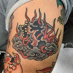 a man with a dragon tattoo on his arm