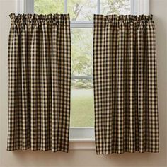 black and white checkered curtains hanging in front of a window