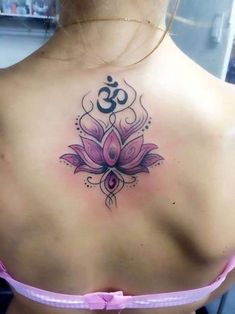 a woman with a lotus tattoo on her back