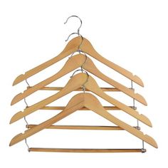 a wooden hanger with six pairs of clothes hanging from it's hooks on a white background