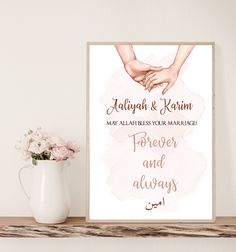 a couple holding hands on top of a wooden shelf next to a vase with flowers