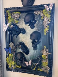 there are many fake skulls in the frame