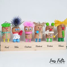 a group of small wooden toy figurines sitting on top of a wooden box