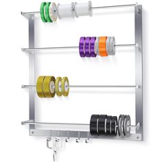 a wall mounted rack with several different colored tapes on it and two rolls of tape hanging from the hooks