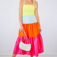 Isn't This Just Perfect. The Colors And Style Just Makes Us Want To Go Out And Have Fun In The Sun. No Matter What Time Of The Day And In Any Occasion For This Season You'll Definitely Be Dressed To Impress. This Adjustable Strap Color Block Tiered Midi Dress 100% Cotton Size Bust Waist Hips S (4-6) 34-35 27-28 36-37 M (8-10) 36-37 29-30 38-39 L (12-14) 38-40 32-33 41-42 Meg Is 5'8 And Wears A Size Small Spring Vacation Color Block Midi Dress, Chic Multicolor Cotton Sundress, Multicolor Color Block Midi Dress For Spring, Spring Multicolor Color Block Midi Dress, Spring Cotton Color Block Dress, Multicolor V-neck Midi Dress For The Beach, Playful Multicolor Tiered Dress, Vibrant Print A-line Beach Dress, Leopard Print Wrap Dress