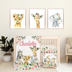 a baby's room with three animal prints on the wall and a crib