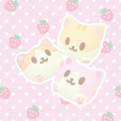 two cats stickers sitting on top of a pink surface with strawberries around them