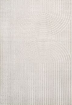 a white rug with an abstract design on the top and bottom part of it's surface