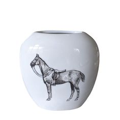 a white vase with a drawing of a horse on it's front and side