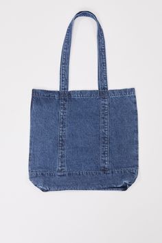 This Carryall Tote Bag is just what you need this season! Crafted from denim for a stylish, yet durable bag. We’ve also designed these with colored nylon straps for a unique and fun look. Made with re-enforced stitching at the base of handles to endure wear and tear. Featuring a functional large front pocket for convenience. This bag is perfect for effortless wear on arms or shoulders. Dimensions Horizontal Tote:Height: 35 cmWidth: 49 cmDepth: 8.5 cm Handle Length: 32 cm Dimensions Vertical Tote Casual Shoulder Bag With Pockets For Weekend, Casual Weekend Shoulder Bag With Pockets, Denim Blue Cotton Canvas Bag For School, Trendy Everyday Denim Blue Canvas Bag, Casual Cotton Canvas Bag With Adjustable Straps, Trendy Denim Blue Canvas Bag For Everyday, Denim Blue Cotton Bag With Adjustable Strap, Trendy Weekend Bags With Pockets, Trendy Recycled Denim Bag With Pockets