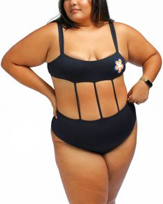 This one-piece bathing suit is perfect for achieving the look of a two-piece in an ultra flattering fit! It features thick shoulder straps and high waist, plus medium booty coverage that gives you just the right amount of support. The butter soft fabric is compressive yet not restrictive - ideal for all your water and sand adventures! Make a splash in this plus-size one-piece from our size-inclusive swimwear collection. Mary Mercedes Swim Mary one piece swimsuit | Black | Swimsuits | Materials & Inclusive Swimwear, Cape Sweater Ponchos, Wrap Dress Casual, Black One Piece Bathing Suit, One Piece Swimsuit Black, Winter Coat Parka, Swimsuit Material, Plus Size One Piece, Swimsuit Black