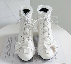 Fashion Lolita Bowtie Boots PN3713 ●Size:please see the picture. ●Heel Hight:about 3.5 cm ●Material:PU (Please allow 1-3cm differs due to manual measurement.As different computers display colors differently,the color of the actual may vary slightly from the above images.Thanks for your understanding.) ●About Shipping: We attach great importance to the orders of each customer and parcel delivery. 1.Processing time: 2-3 business days. 2.Shipping time: 10-15 business days to US, please allow 3-4 weeks shipping to other country.(Shipping times can be affected by variable customs clearance times or public holidays.) Cute White Lace-up Boots, White Vintage Boots For Spring, Vintage White Boots For Spring, Cute White Closed Toe Boots, Fitted White Lace-up Boots, White High Heel Boots With Laces, White Lace-up Boots, White Lace-up Vintage Boots, Vintage White Lace-up Boots