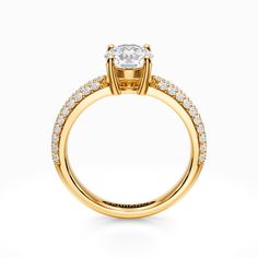 a yellow gold engagement ring with diamonds on the side