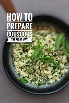 how to prepare couscous in a black bowl with mint leaves on the side