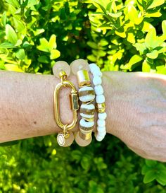 These distinctive pink/peach African recycled glass beads are divine. Mixed with white/cream Mala beads, white/cream & brown Krobe beads and 14k gold plated accents beads.  Bracelets measure 7 inches long. Left to Right: *Pink/peach recycled glass bracelet is strung on 24k gold plated thread and attached with a 14k gold carabiner.  *White/Cream/Brown Krobe beads, pink/peach/ recycled glass and gold accent beads. *White mala beads with a gold hammered bead. All gold-plated and gold-filled jewelry accessories are plated with the highest quality however, to further help preserve jewelry, please avoid water (shower, pool, hot tubs, ocean, etc.), lotion, perfumes and other liquids when wearing.  This is a hobby turned business, I love creating afordable and unique jewelry with a mix of colors, Stack Bracelets, Unique Handcrafted Jewelry, Recycled Glass Bead, Beads Bracelets, Gold Bracelets, Creating Jewelry, Glass Bracelet, Glass Beaded Bracelets, Hot Tubs