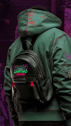 a person wearing a green jacket and black backpack with graffiti on it's back