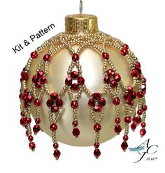 a christmas ornament with red beads on it