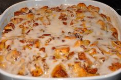 a casserole dish with cheese and nuts in it