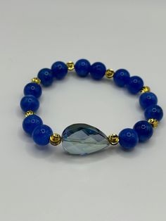 Blue jasper bracelet with accent beads. Blue jasper stone can create empowerment. It also lets you handle stressful situations calmly. Blue Gemstone Bracelets For Everyday Wear, Blue Gemstone Beads Bracelet For Everyday, Everyday Blue Gemstone Beads Bracelets, Everyday Blue Gemstone Beads Bracelet, Elegant Blue Stretch Bracelet With Natural Stones, Blue Spiritual Stretch Bracelet With Faceted Beads, Blue Natural Stones Beaded Bracelets For Meditation, Spiritual Blue Beaded Bracelets For Everyday, Everyday Blue Beaded Bracelet With Natural Stones