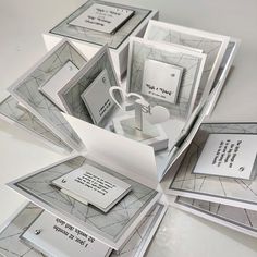 a bunch of cards that are stacked on top of each other with some writing on them