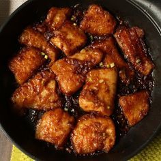 some food is cooking in a pan on the table